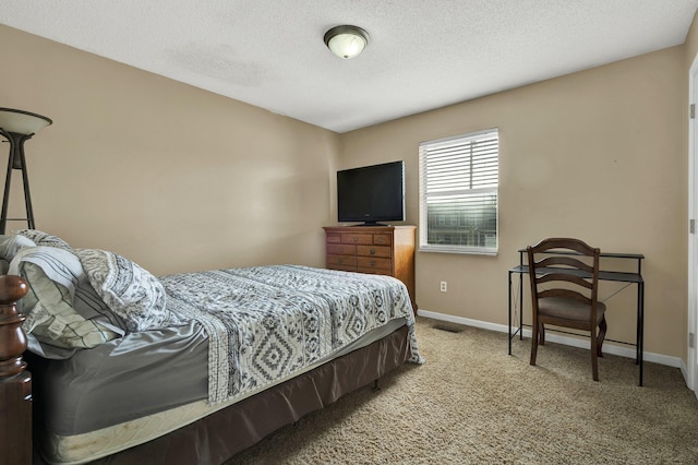 carpeted bedroom featuring visible vents, a textured ceiling, and baseboards