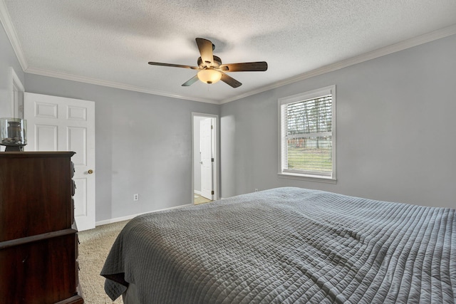 carpeted bedroom featuring ornamental molding, a textured ceiling, baseboards, and a ceiling fan