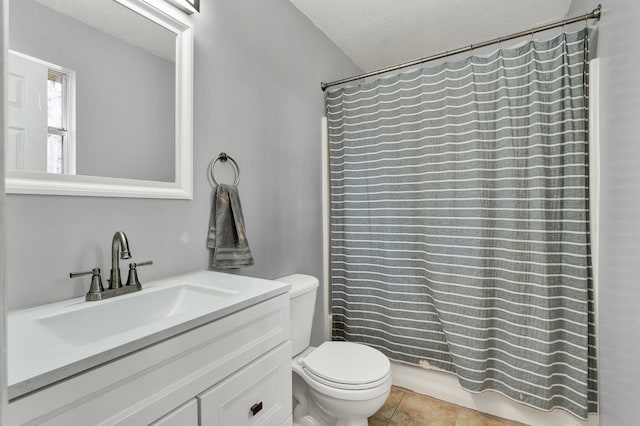 full bath with toilet, a shower with curtain, tile patterned floors, a textured ceiling, and vanity