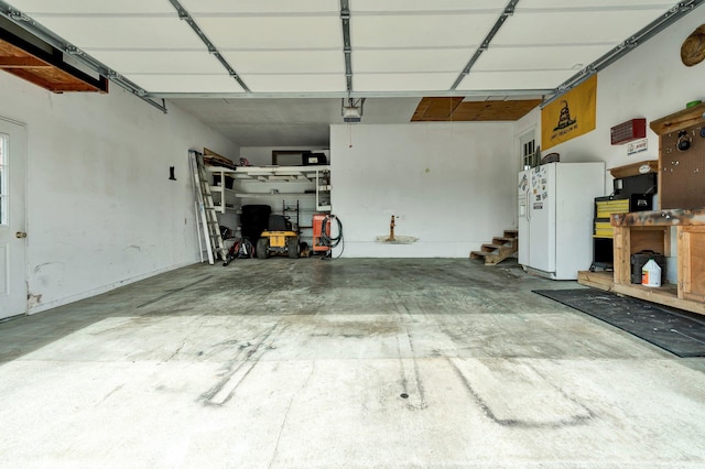 garage with white fridge with ice dispenser