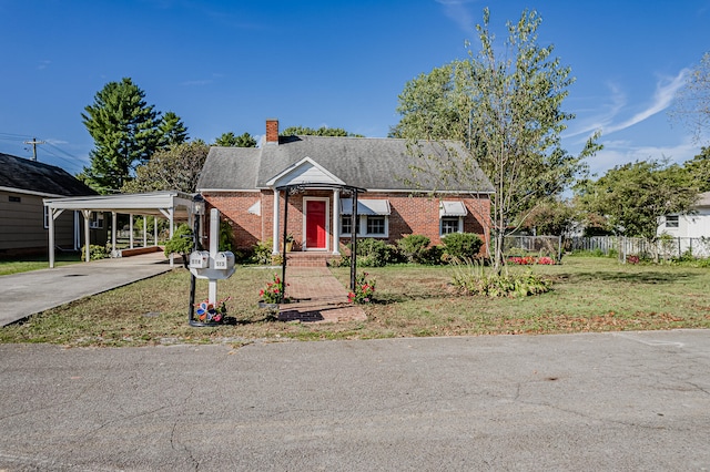 bungalow-style home with a front yard and a carport