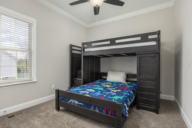 carpeted bedroom with ceiling fan and crown molding