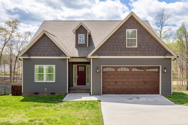 view of front of home featuring a front yard and a garage