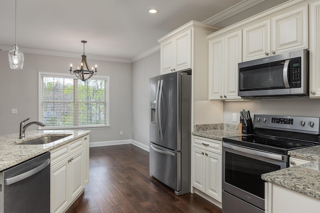 kitchen with light stone counters, stainless steel appliances, sink, decorative light fixtures, and a notable chandelier