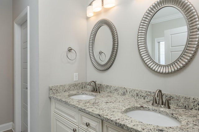 bathroom featuring vanity and ornamental molding