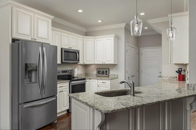 kitchen with kitchen peninsula, a kitchen breakfast bar, light stone counters, stainless steel appliances, and sink