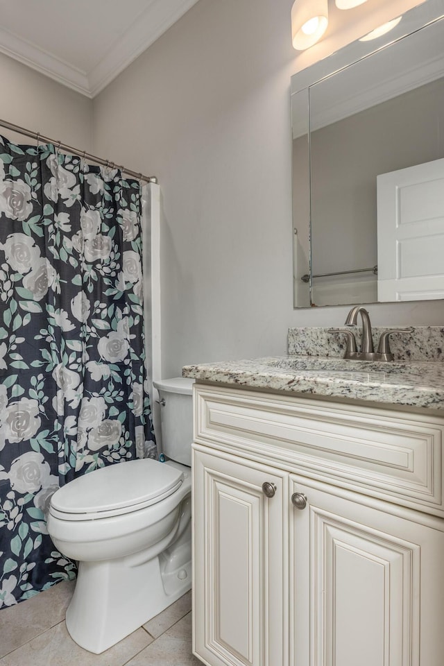 bathroom with tile patterned floors, crown molding, vanity, and toilet