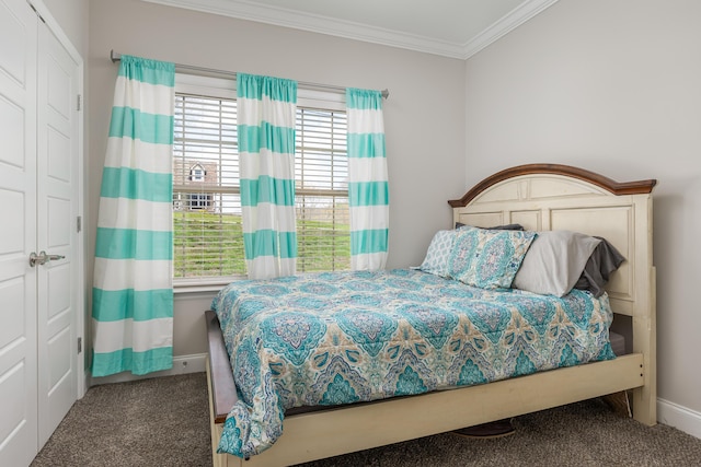 bedroom featuring dark carpet, multiple windows, crown molding, and a closet