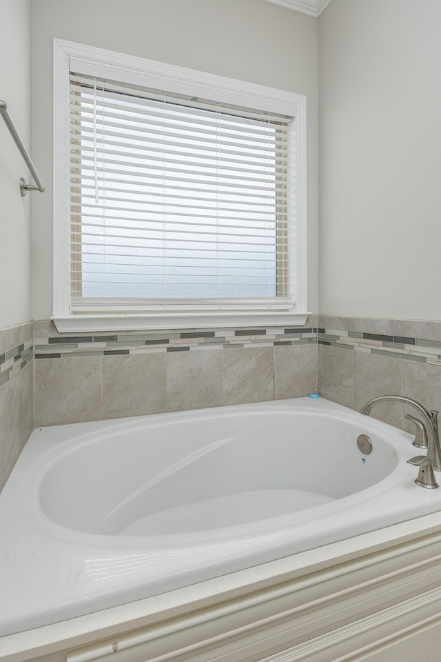 bathroom with a tub to relax in