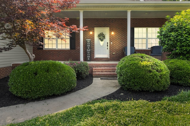 104 Shadows Lawn Dr, Athens, TN 37303 - doorway to property featuring brick siding and covered porch