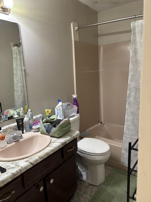 full bath featuring toilet, vanity, tile patterned flooring, and shower / bath combo