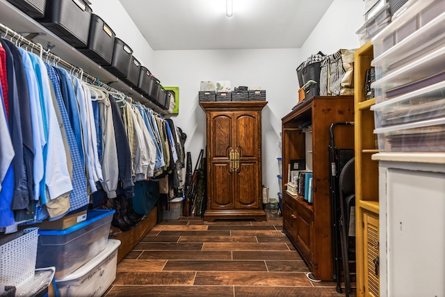 walk in closet with wood tiled floor