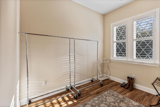 interior space with dark wood-style floors and baseboards