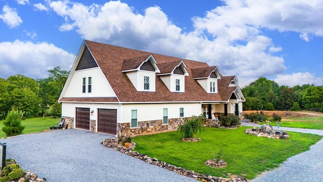 view of front of home with driveway, a garage, a shingled roof, stone siding, and a front lawn