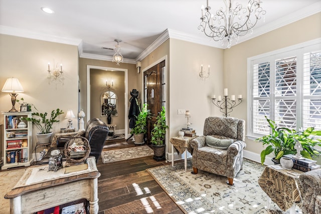 entrance foyer featuring visible vents, an inviting chandelier, ornamental molding, dark wood-type flooring, and baseboards