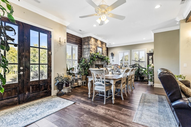 dining space with baseboards, ornamental molding, dark wood-style flooring, and french doors