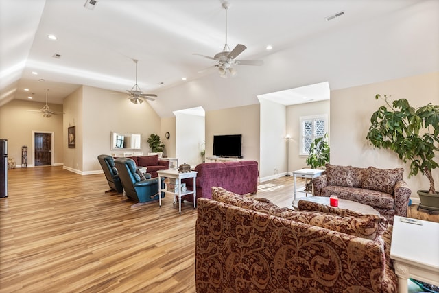 living area featuring light wood-type flooring, ceiling fan, baseboards, and recessed lighting