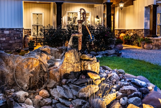 details with stone siding and a wood stove