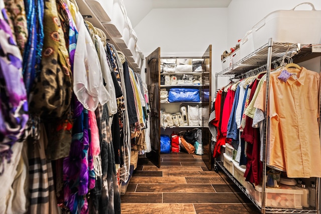 walk in closet featuring lofted ceiling and wood tiled floor