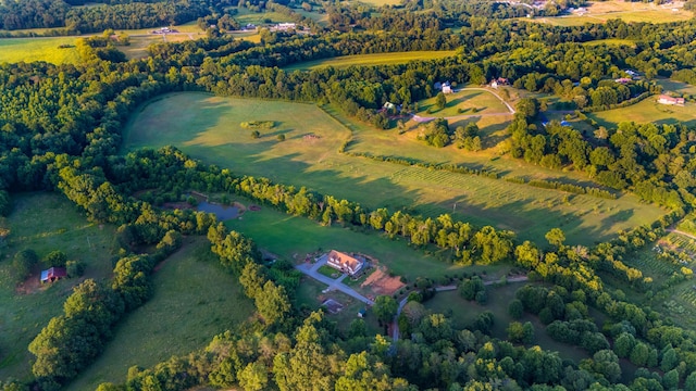 aerial view featuring a rural view and a view of trees