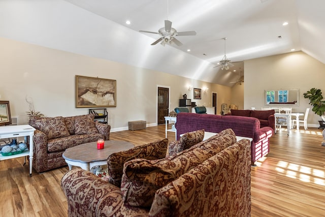 living area featuring baseboards and light wood-style floors