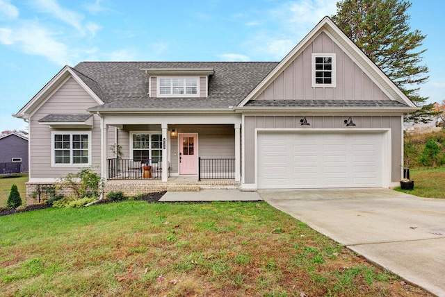 view of front of house with a porch and a front yard