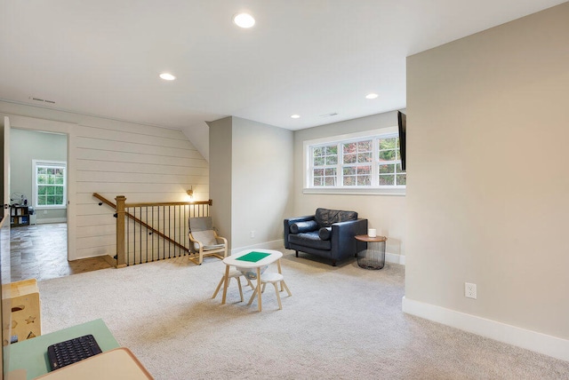 sitting room featuring carpet flooring