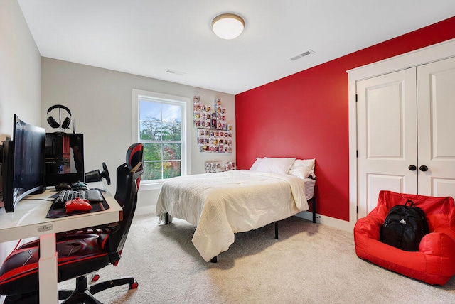 carpeted bedroom with a closet