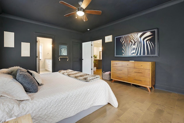 bedroom featuring connected bathroom, ceiling fan, dark wood-type flooring, and ornamental molding