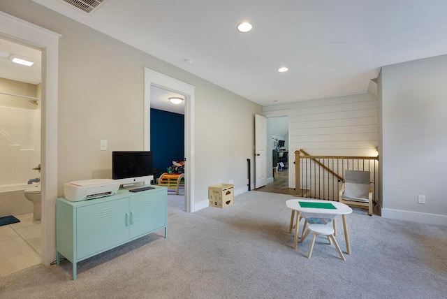 sitting room with light colored carpet