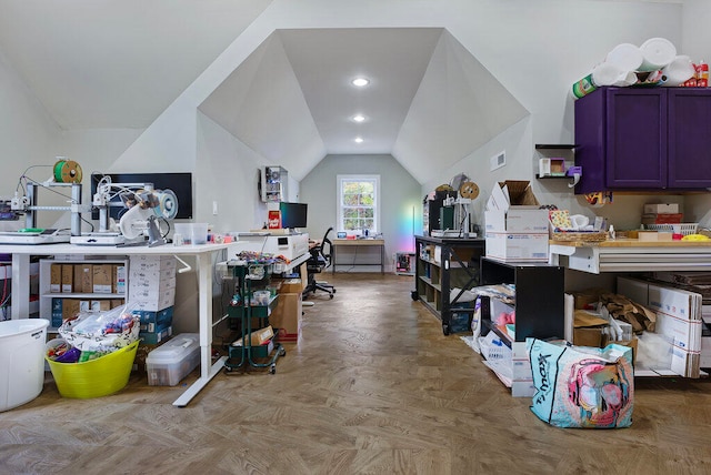 home office with light parquet flooring and vaulted ceiling