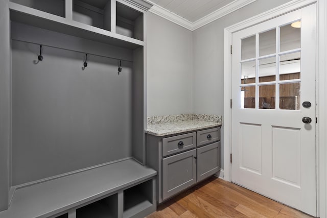 mudroom with light wood-style flooring and ornamental molding