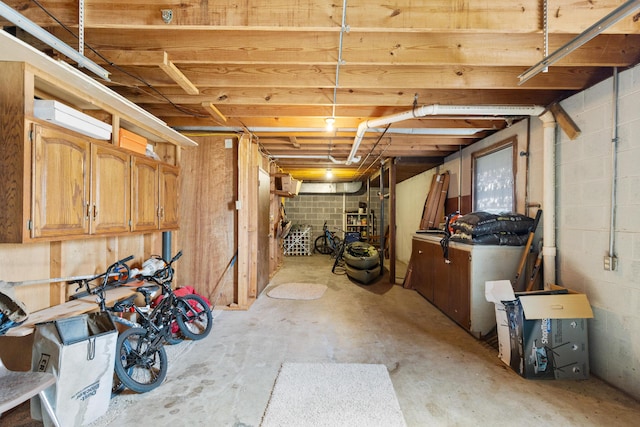 unfinished basement with concrete block wall