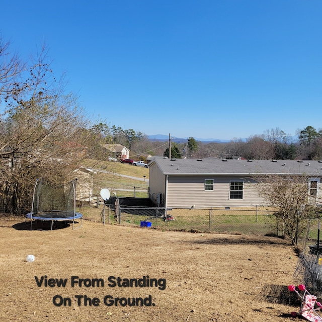 view of yard with a trampoline