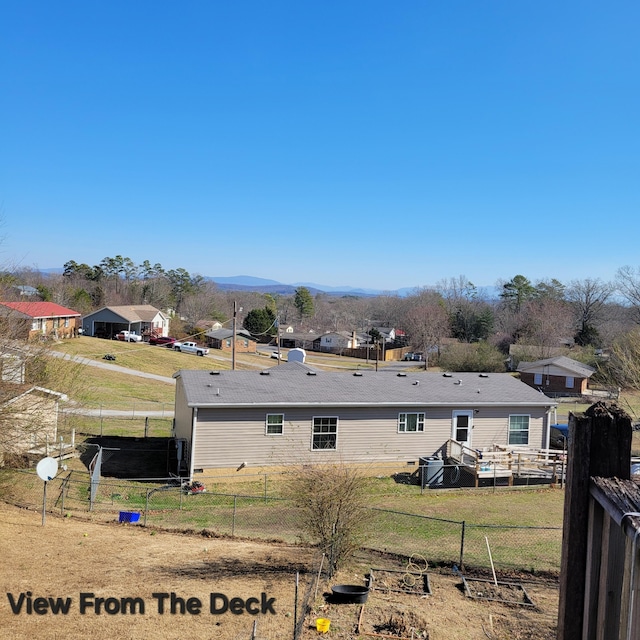 rear view of property featuring a mountain view