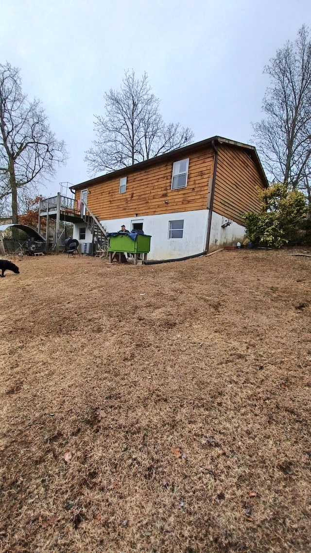 back of property featuring a deck