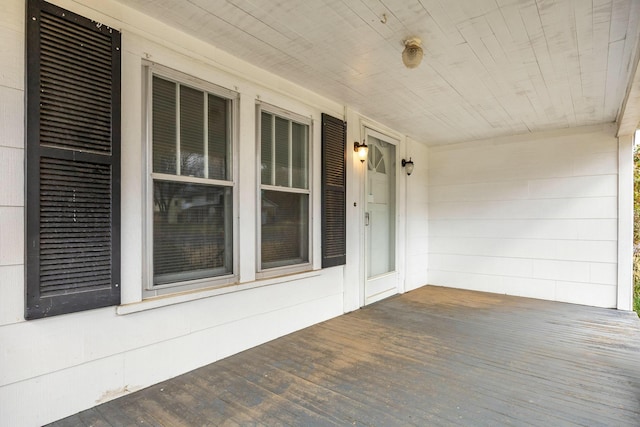 unfurnished sunroom with wood ceiling