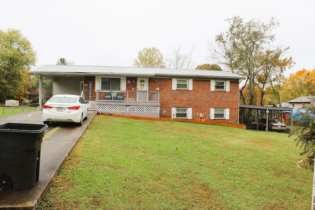 view of front of property with a carport, covered porch, and a front lawn