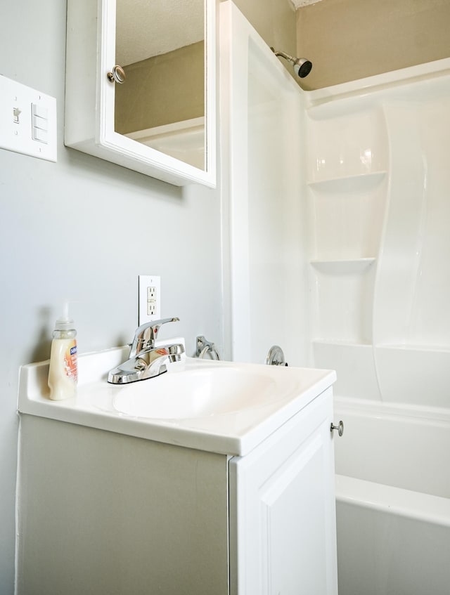 bathroom with vanity and shower / bathtub combination