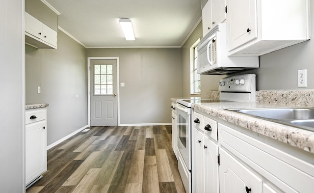 kitchen featuring white cabinets, dark hardwood / wood-style floors, white appliances, and ornamental molding