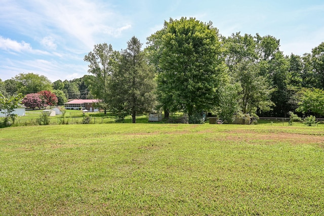 view of yard with a rural view