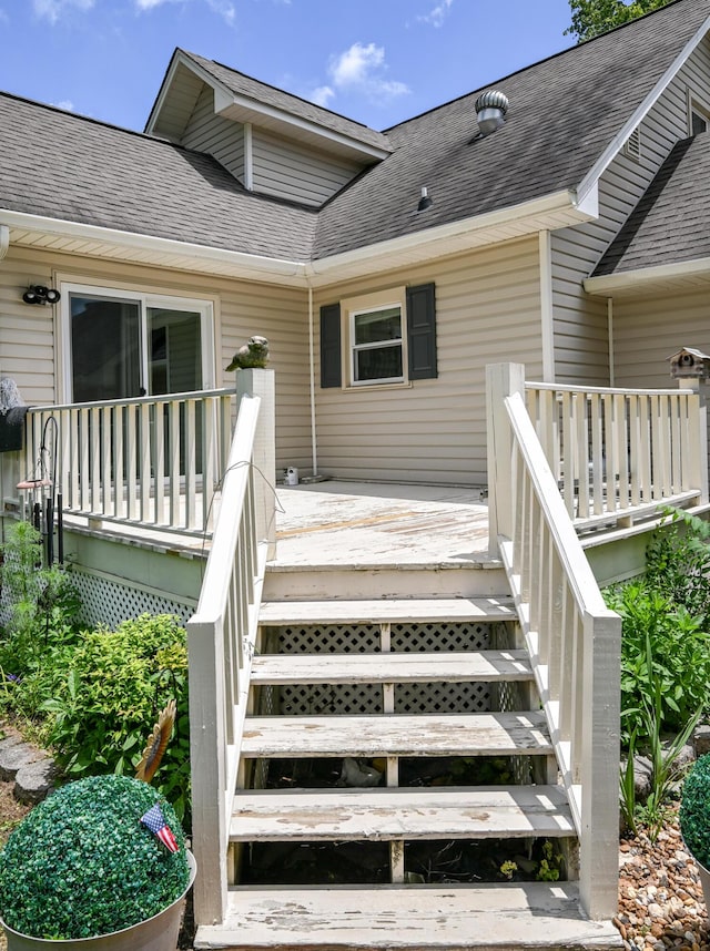 4901 Cindy Cir NW, Cleveland, TN 37312 - view of exterior entry with a shingled roof and a wooden deck