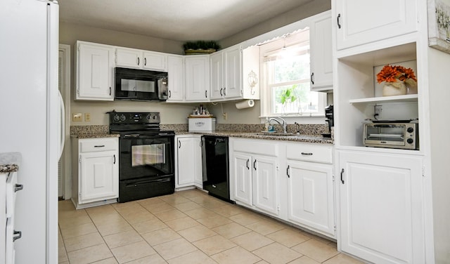 4901 Cindy Cir NW, Cleveland, TN 37312 - kitchen with black appliances, light stone countertops, white cabinets, and light tile patterned floors