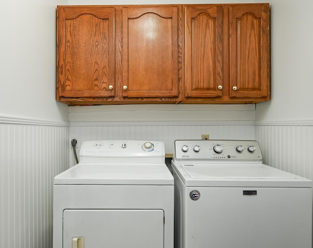 4901 Cindy Cir NW, Cleveland, TN 37312 - laundry area with washing machine and clothes dryer, cabinet space, and wainscoting
