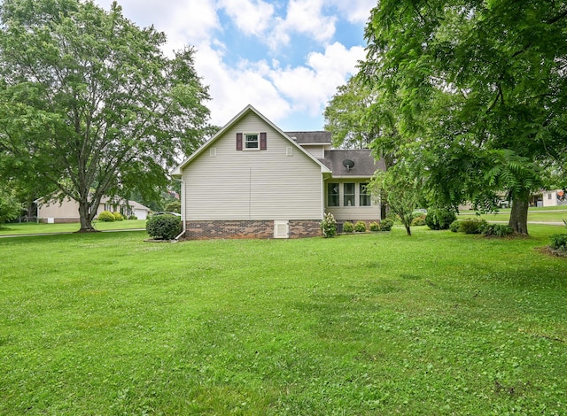 4901 Cindy Cir NW, Cleveland, TN 37312 - rear view of house featuring a lawn and roof with shingles