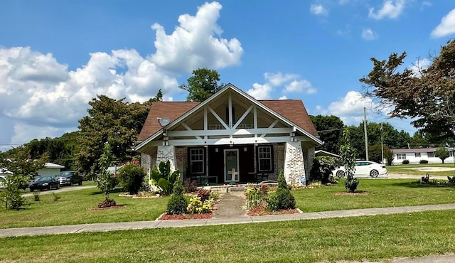 view of front facade with a front yard and a porch