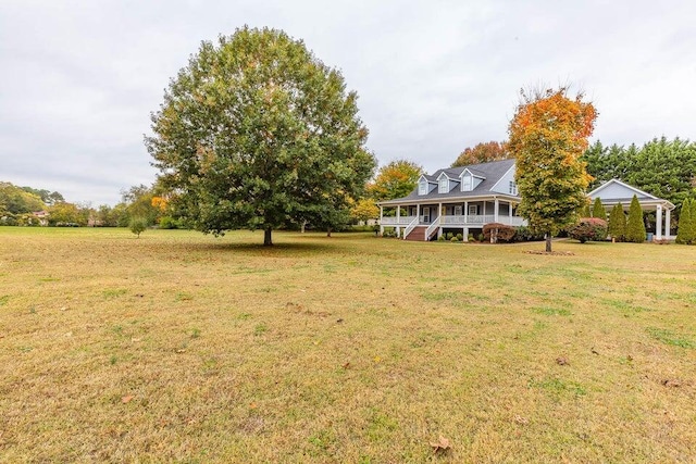 2036 Hickory Valley Rd, Chattanooga, TN 37421 - view of green lawn featuring covered porch