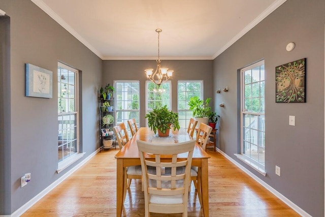2036 Hickory Valley Rd, Chattanooga, TN 37421 - dining room with a chandelier, baseboards, light wood-type flooring, and ornamental molding