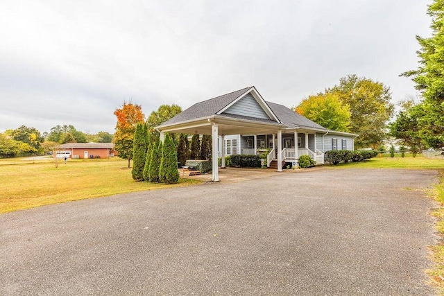 2036 Hickory Valley Rd, Chattanooga, TN 37421 - view of front facade with covered porch, driveway, a front lawn, and an attached carport