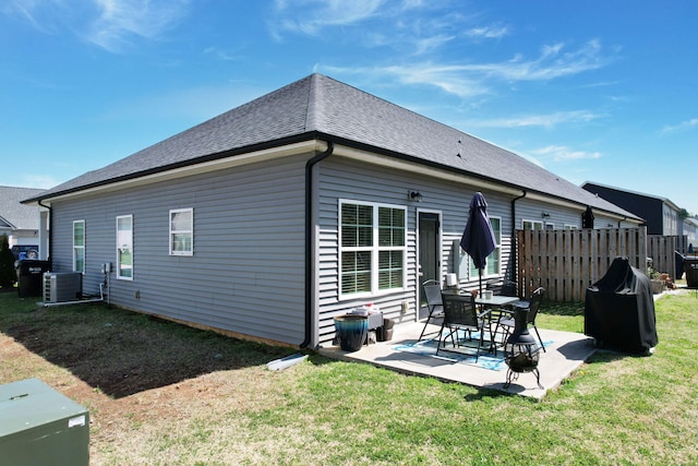 back of property with a yard, central AC, fence, and a patio